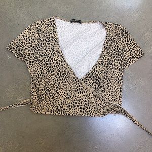 SOLD Brandy Melville Rae cheetah print wrap top!!